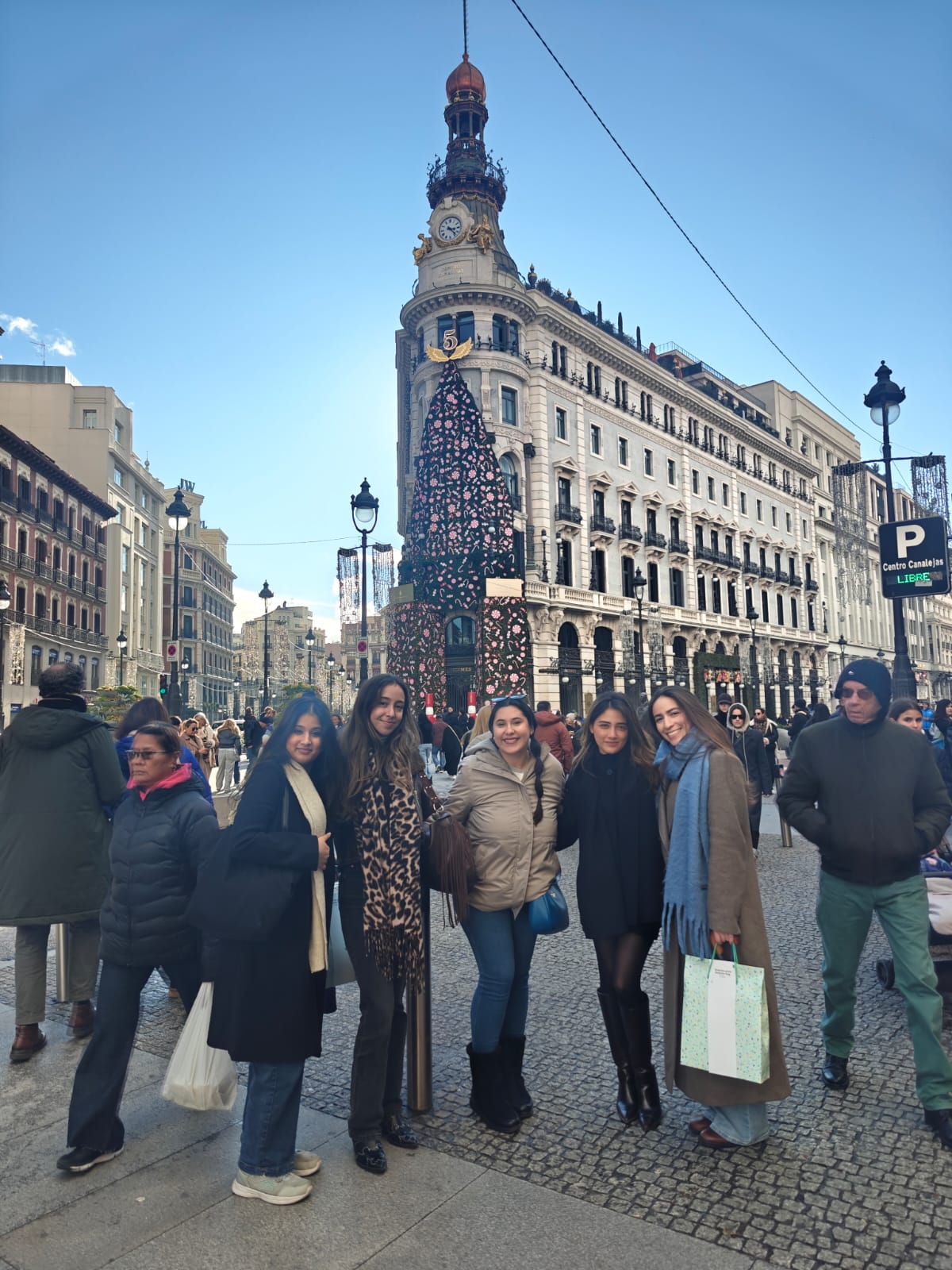 Group of friends on a sunny street in Madrid